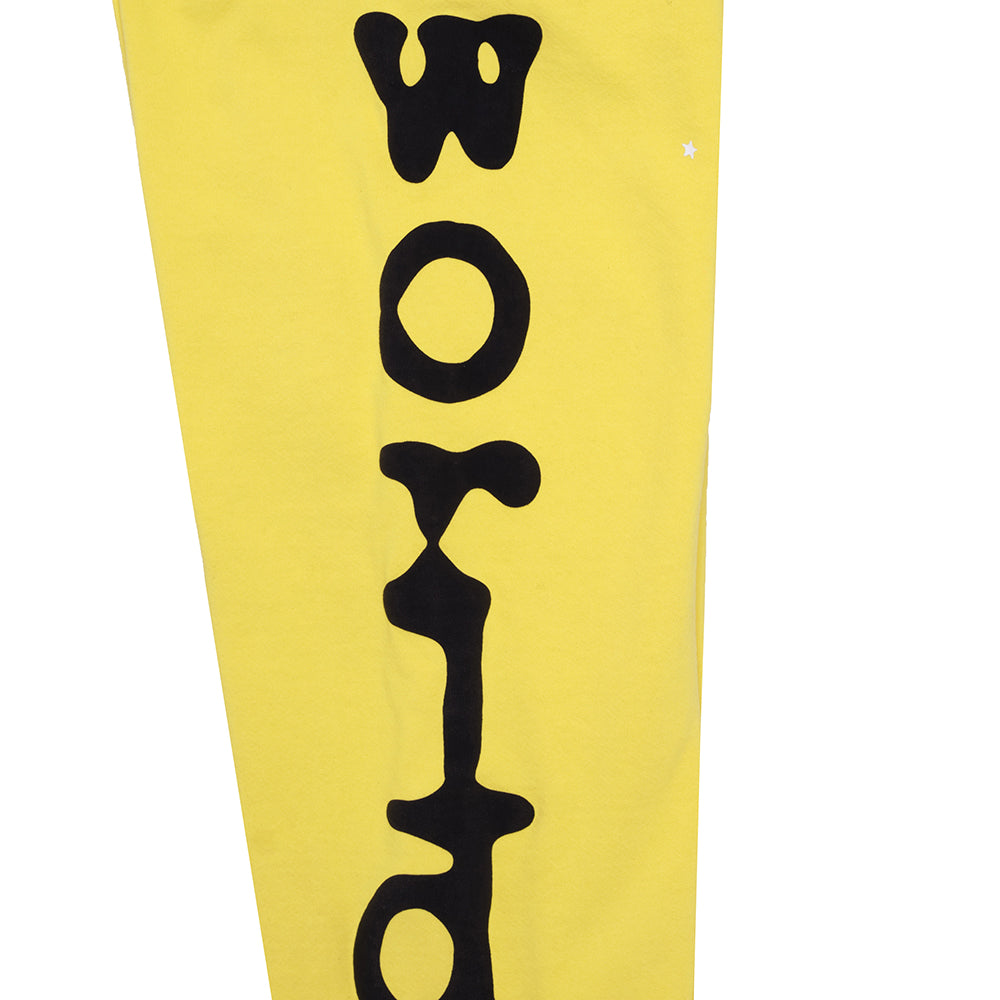 Yellow Beluga sweatpant with black 'World' puff print and small star detail.