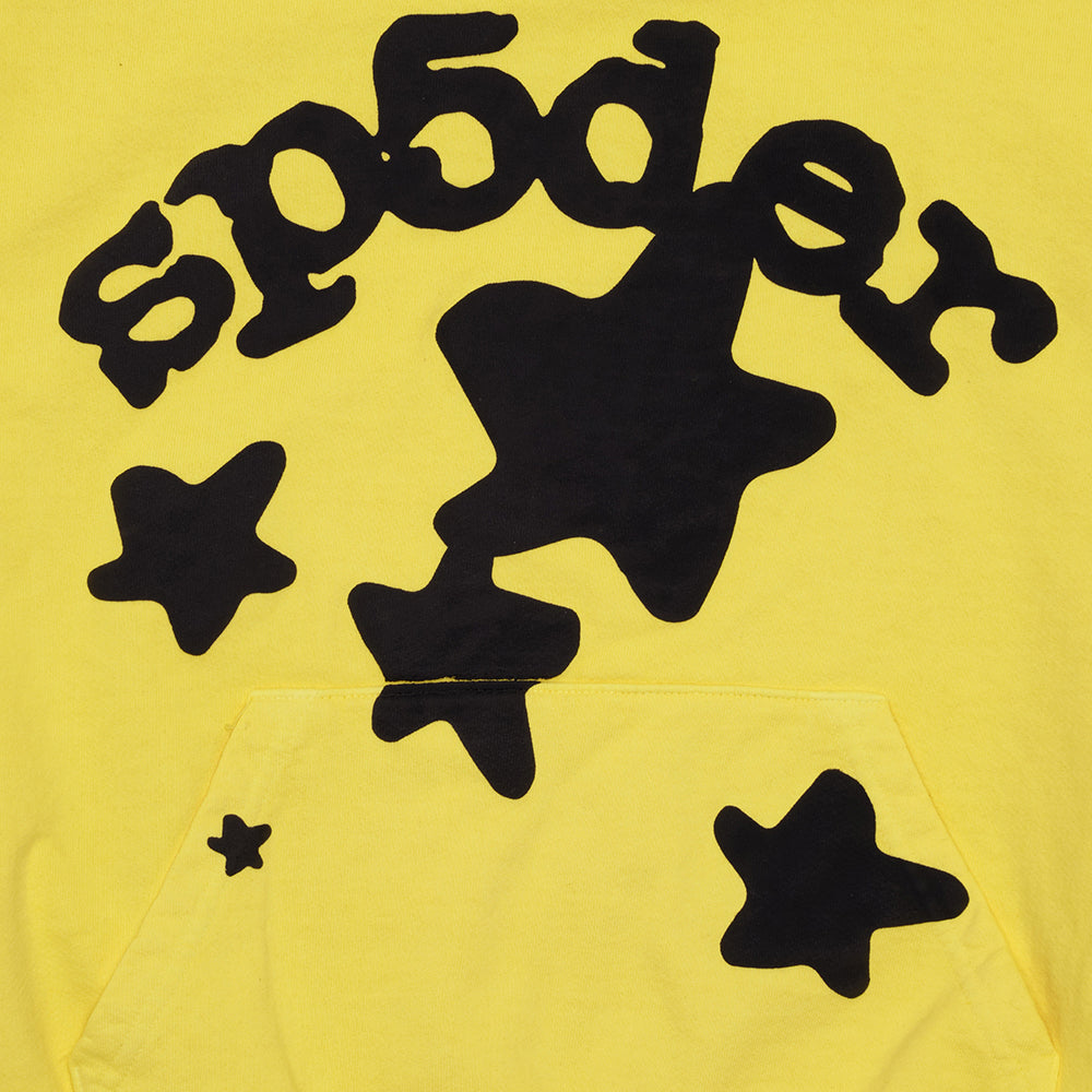 Yellow BELUGA HOODIE with black puff print 'SP5DER' text and star design, featuring a front pocket.