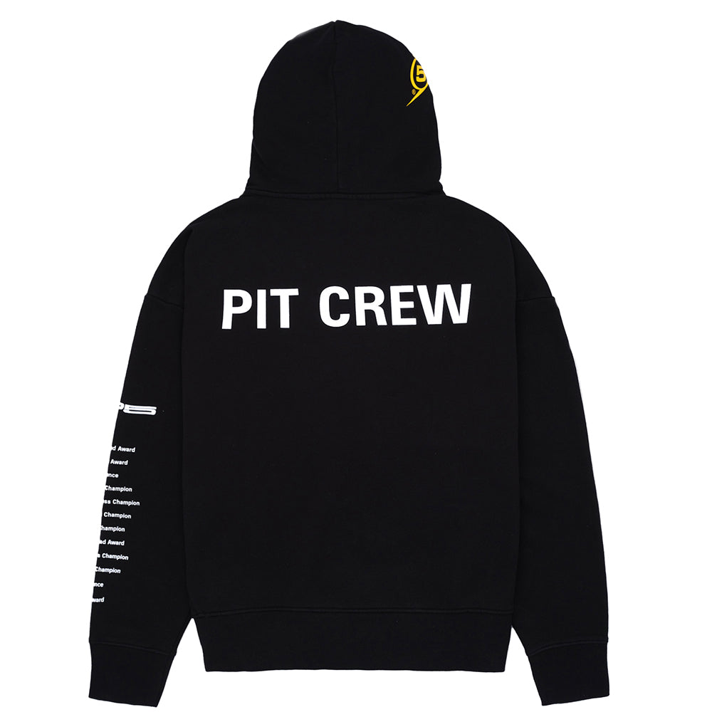 Black oversized 23oz French Terry hoodie with "PIT CREW" graphic on back, yellow logo on hood, and text on sleeve.