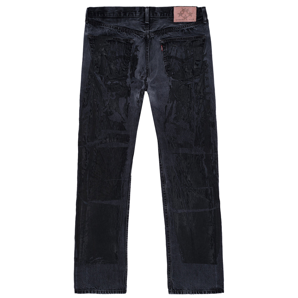 Vintage black Levi's 501 MOTO JEAN with pink SP5DER leather back tab and tonal moto design.