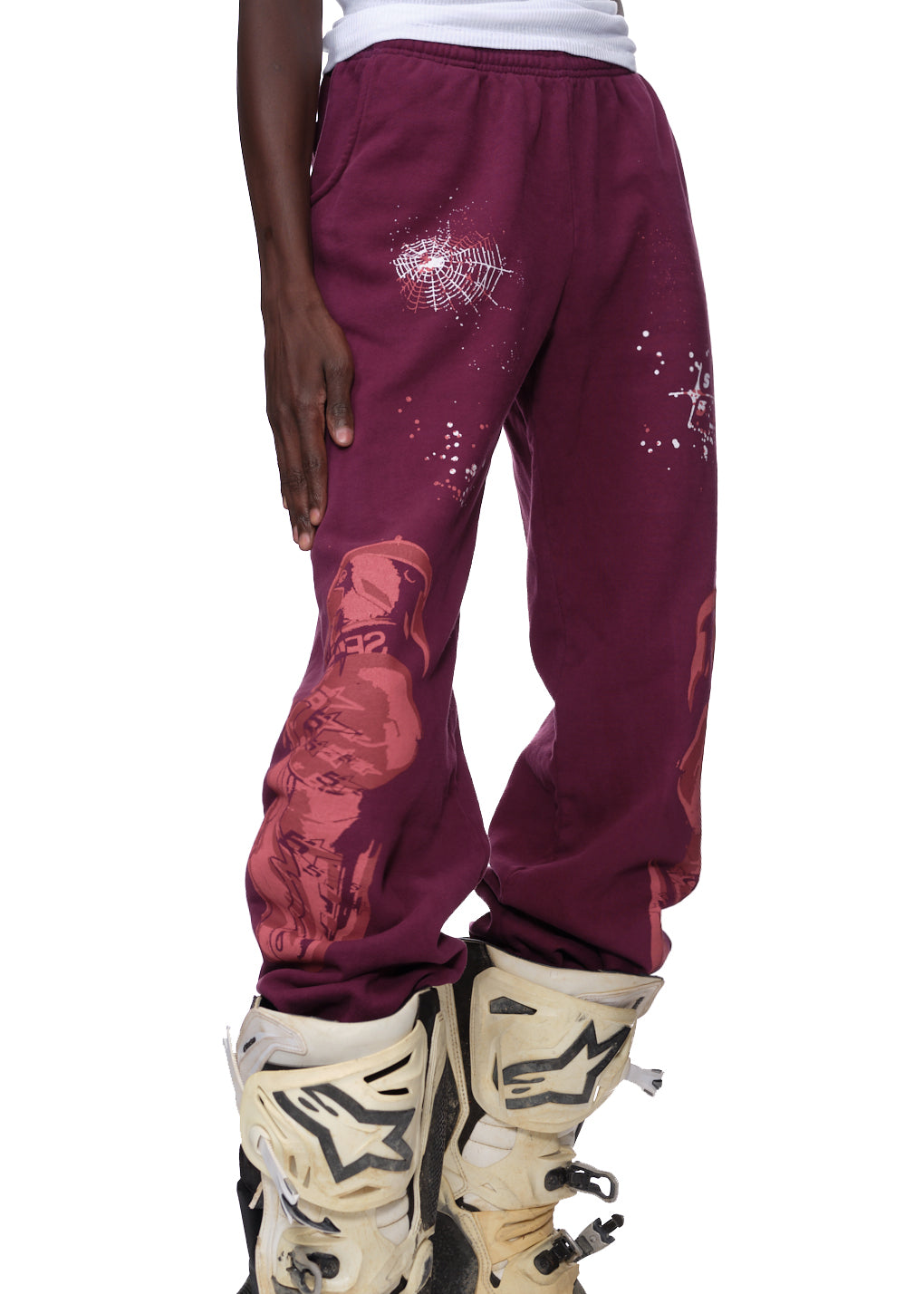 Maroon 23oz fleece sweatpants with white puff print spiderweb and discharge print graphics.