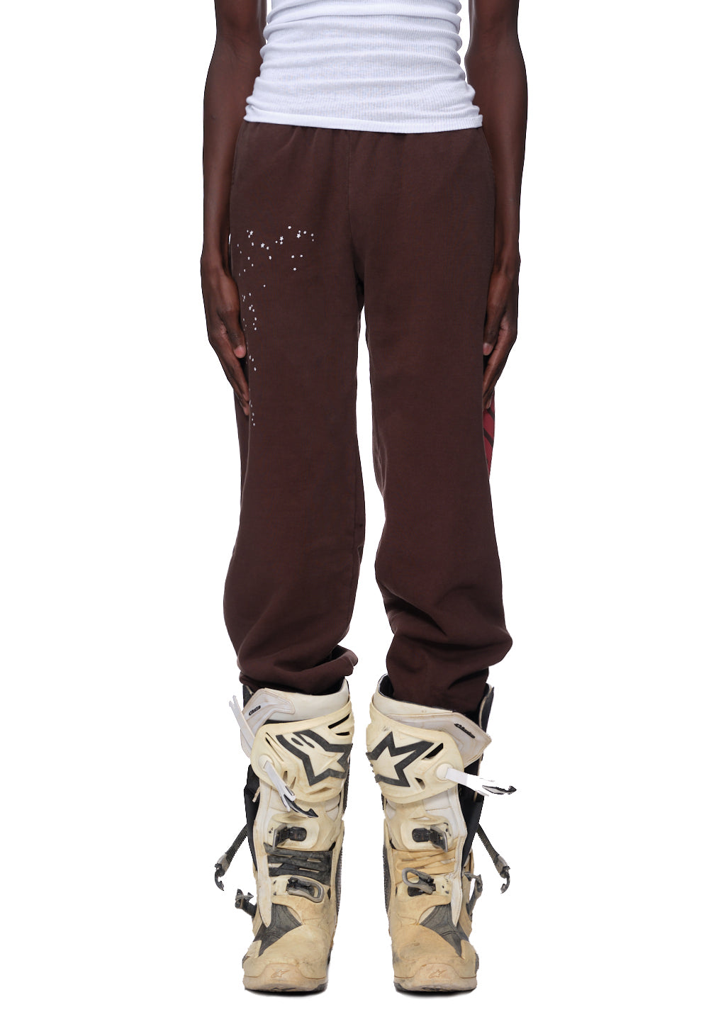 Brown 23oz fleece sweatpants with white puff print and red discharge print "Araignee" down the leg.