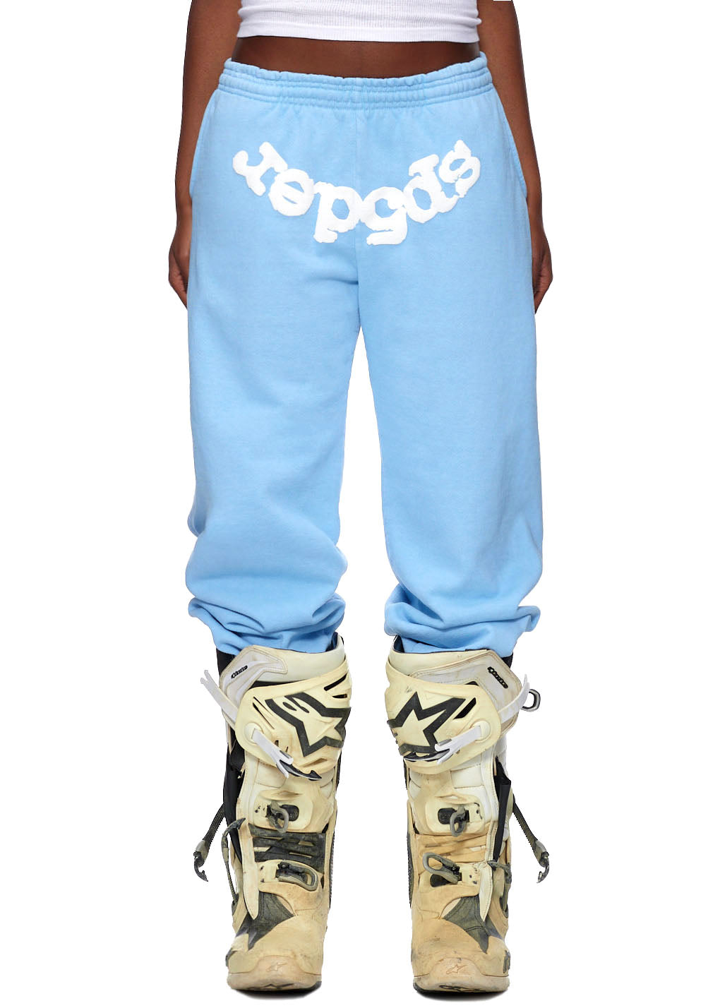 Light blue CLASSIC SWEATPANT with white puff print "SP5DER" logo and web print, worn with motocross boots.