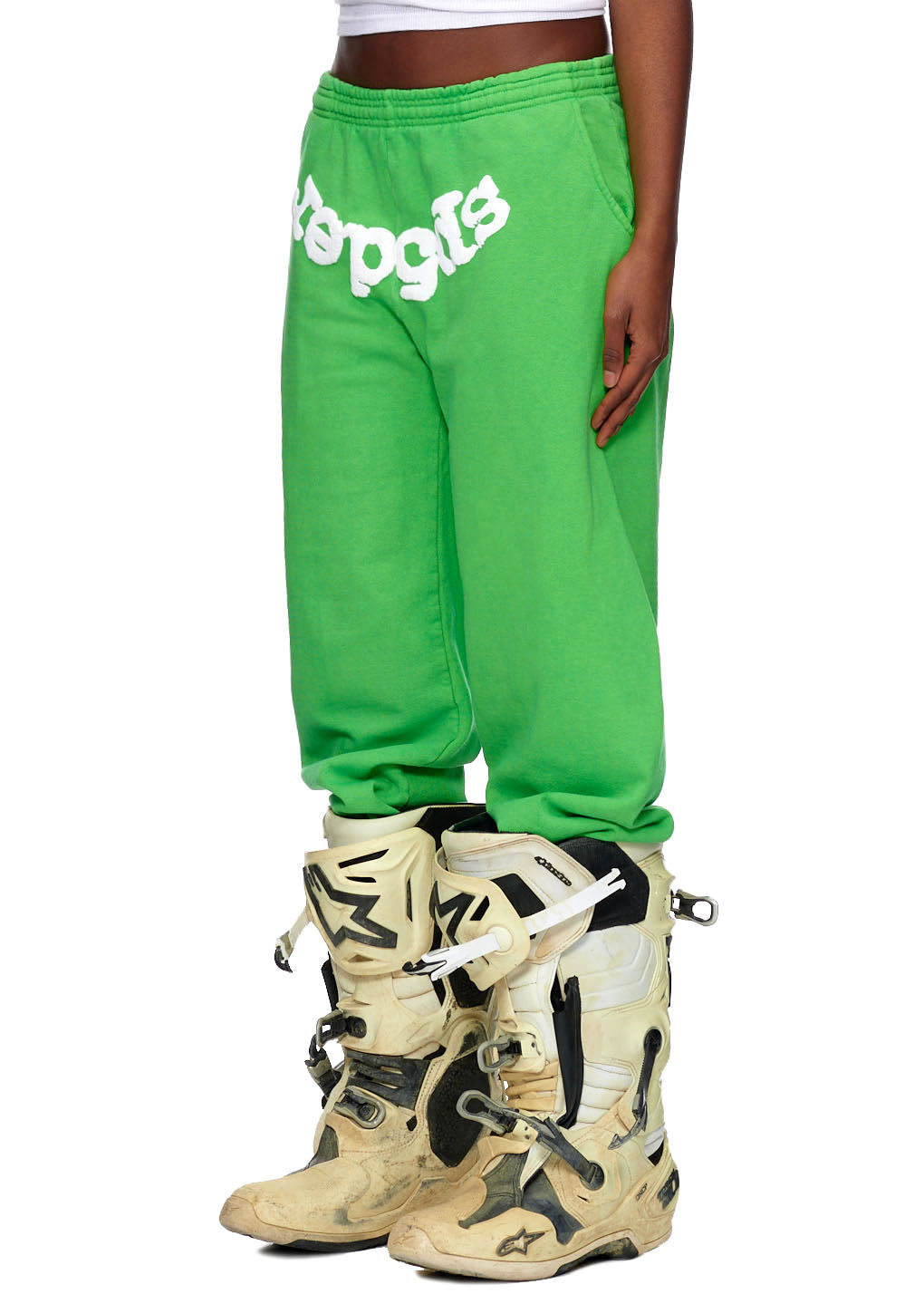 Green CLASSIC SWEATPANT with white puff print "Sp5der" logo and web detail, worn with motocross boots.