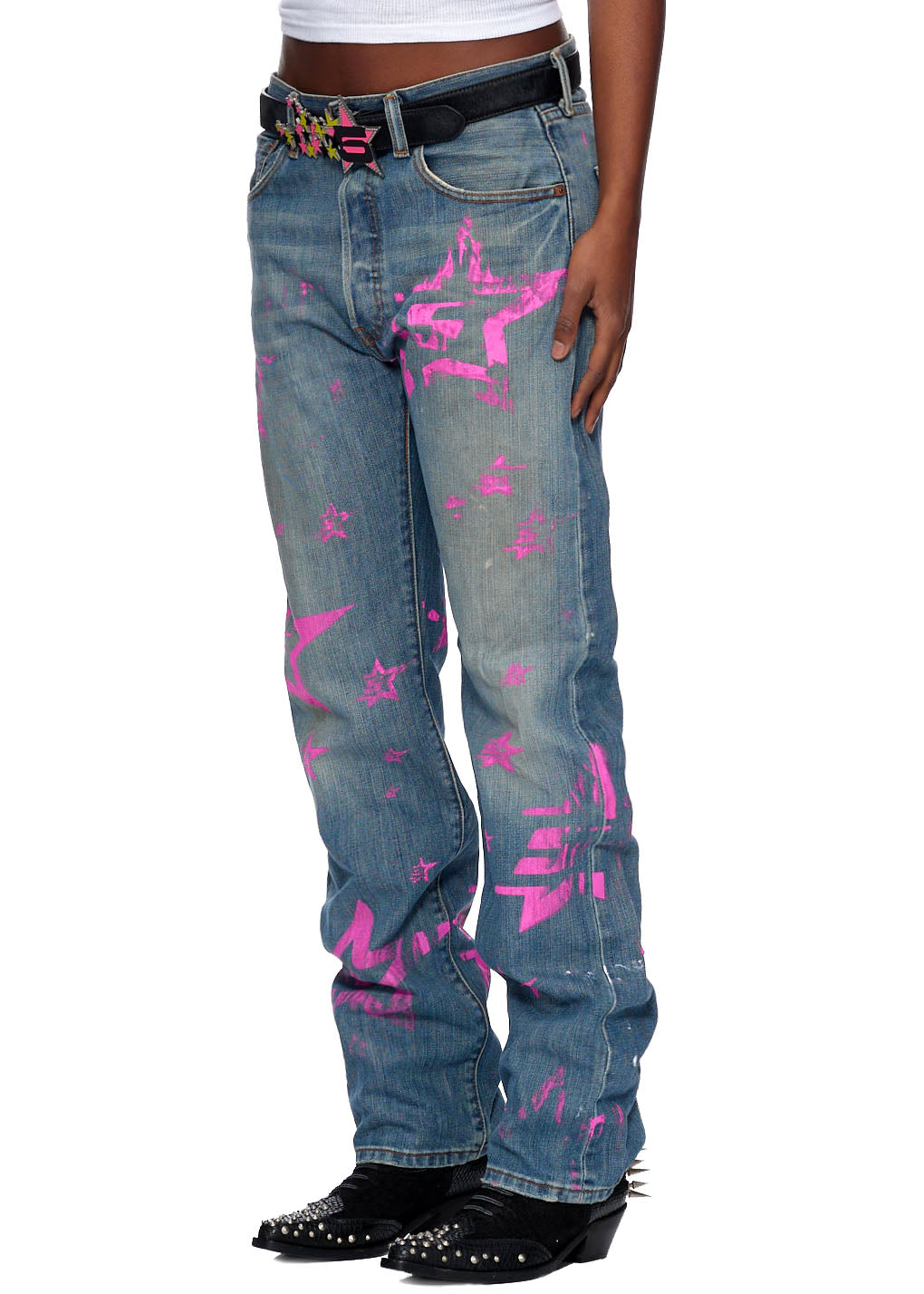 Vintage Levi's 501 jeans with pink "5 Star" graphic, pink SP5DER back tab, and black belt.