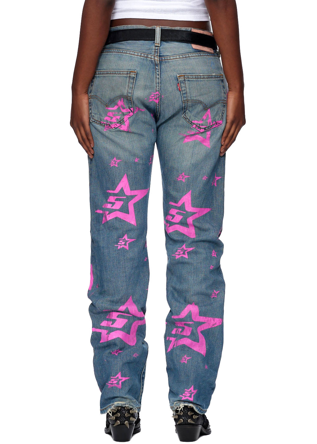 Vintage Levi's 501 jeans with pink "5 Star" graphic, pink SP5DER back tab, and distressed hem.