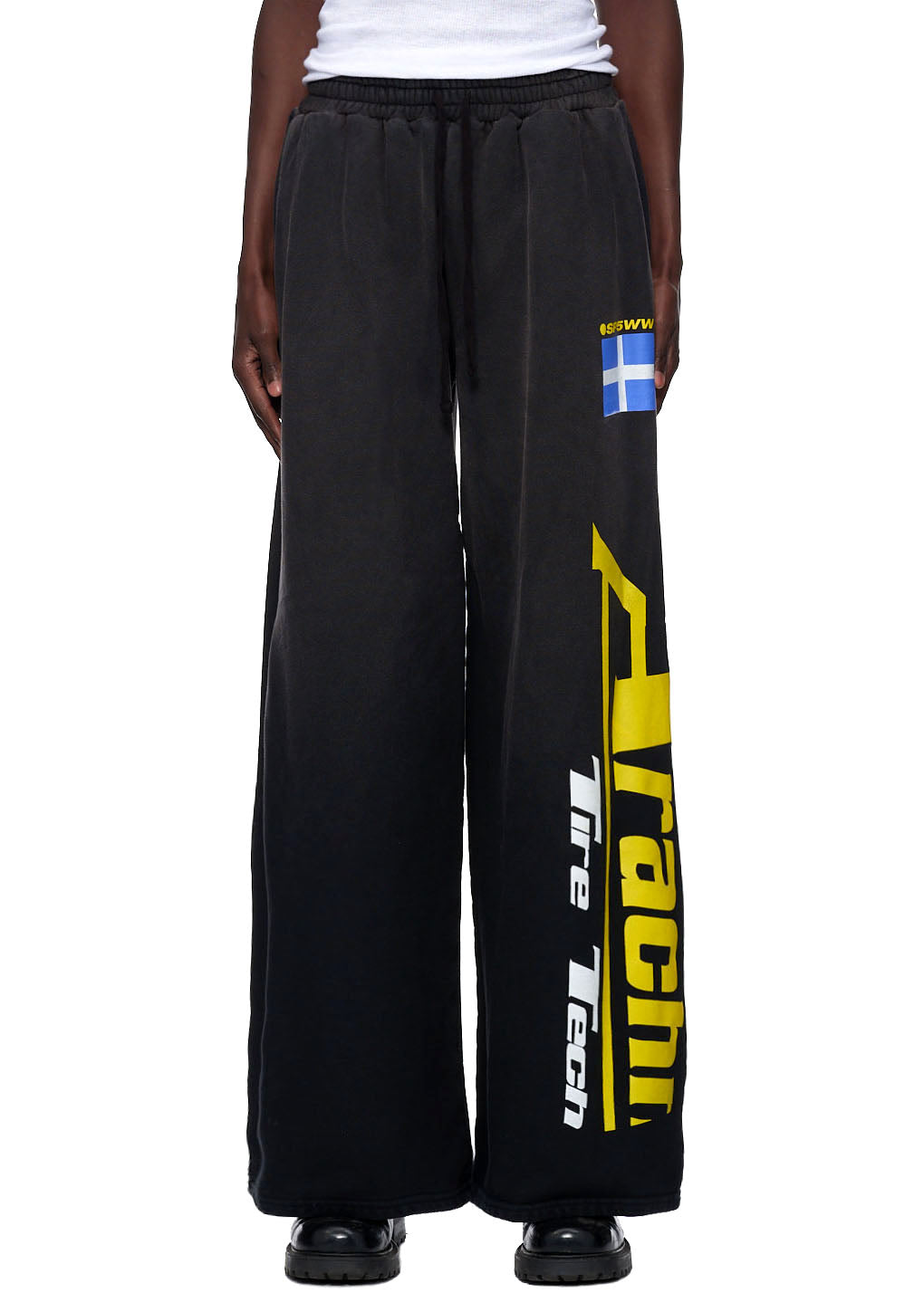 Vintage black 23oz French terry jumbo sweatpants with yellow "Racing Tire Tech" screen print and Swedish flag.