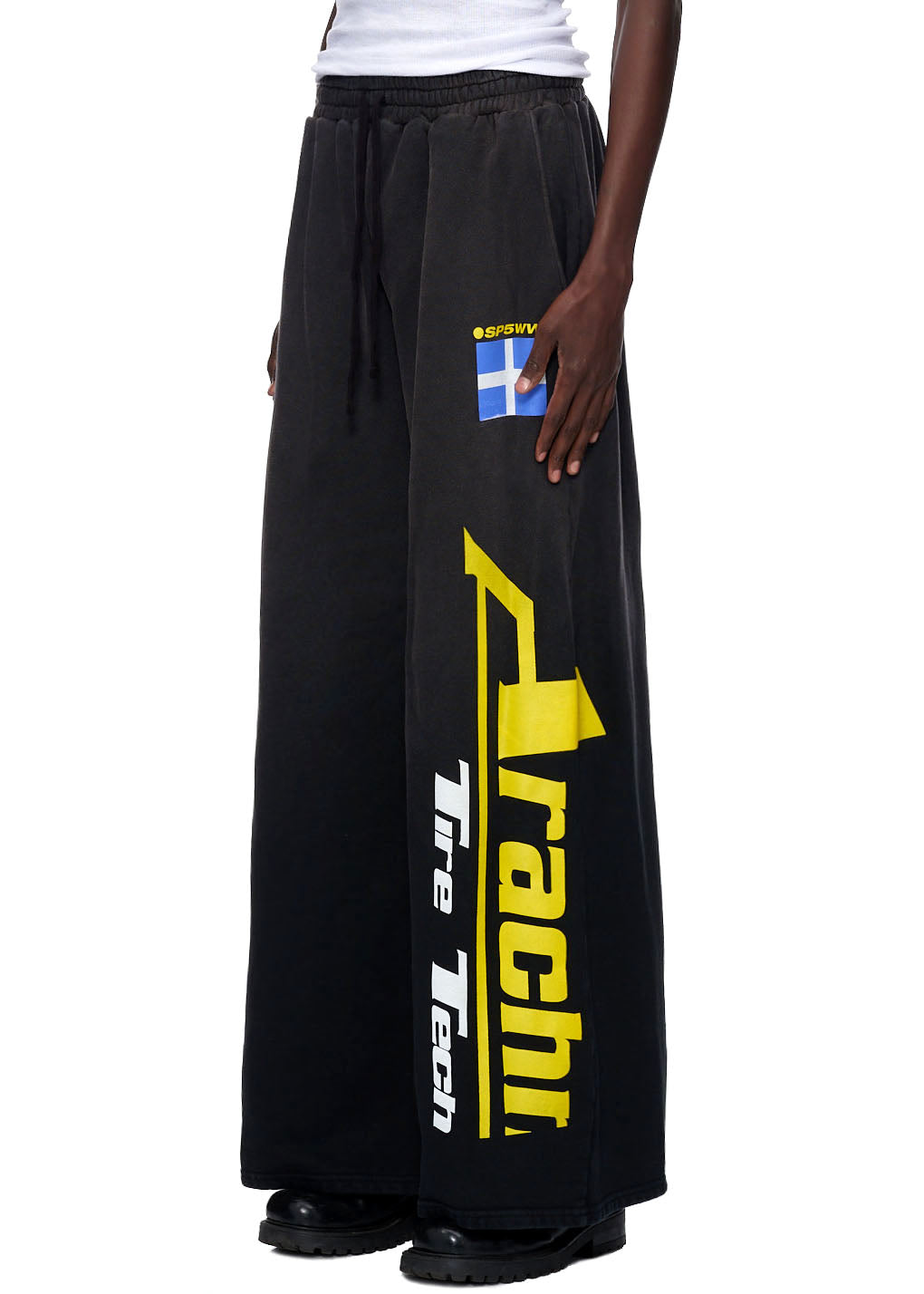 Jumbo vintage black 23oz French terry sweatpants with yellow "Arachni Racing Tire Tech" screen print and flag patch.