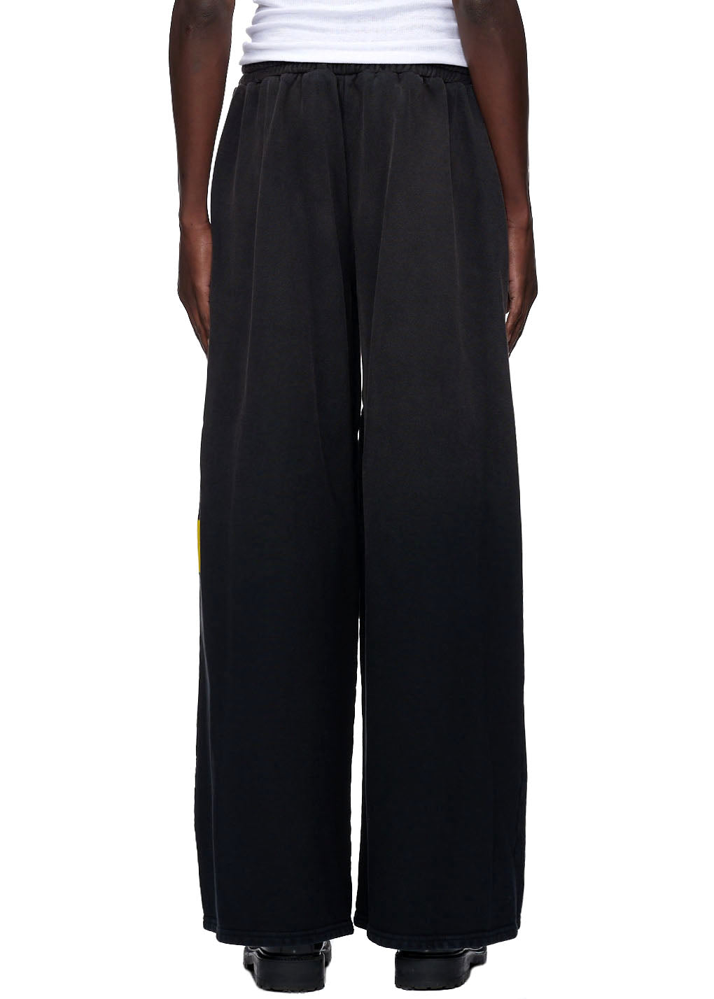 Jumbo vintage black 23oz French terry sweatpants with yellow screen print down the leg.