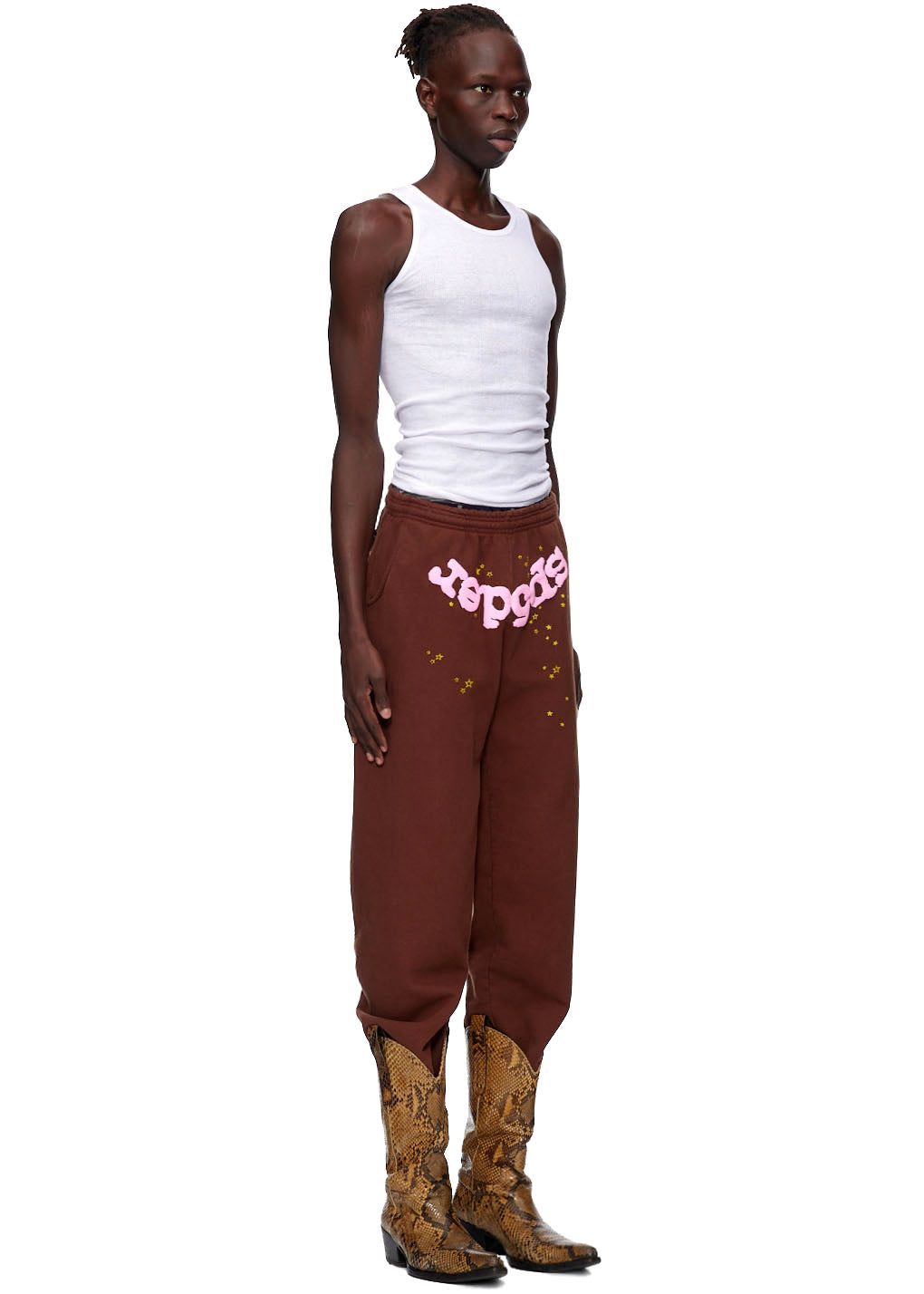 Brown CLASSIC SWEATPANT with pink puff print "sp5der" and gold discharge print stars, worn by a model.