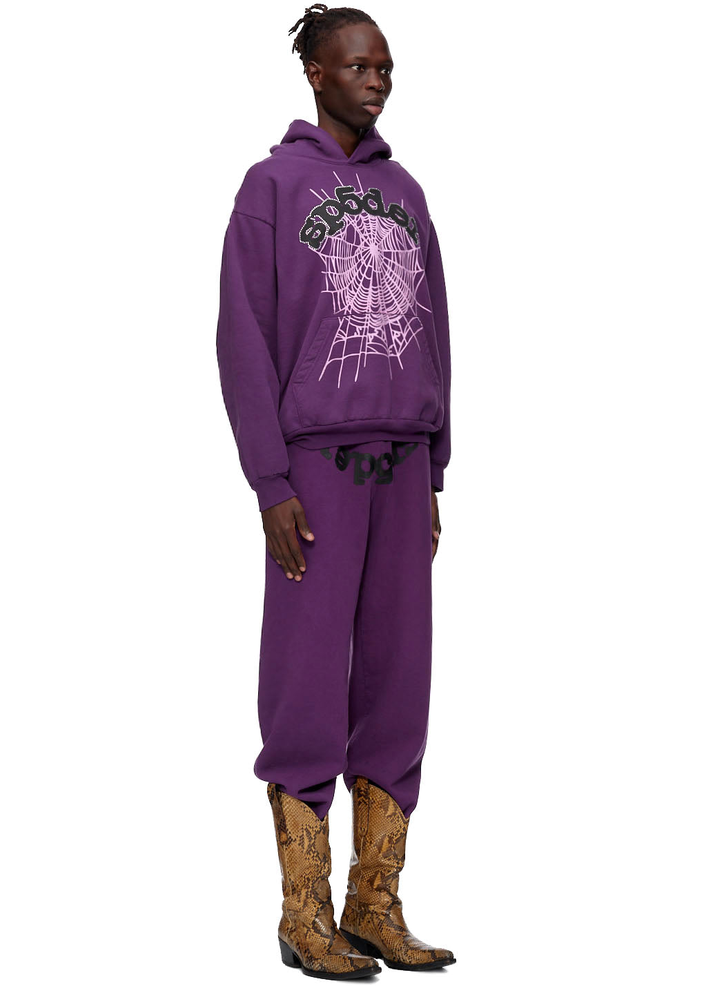 Purple 23oz fleece WEB HOODIE with SP5DER web puff/discharge/high-density print, worn by a model.