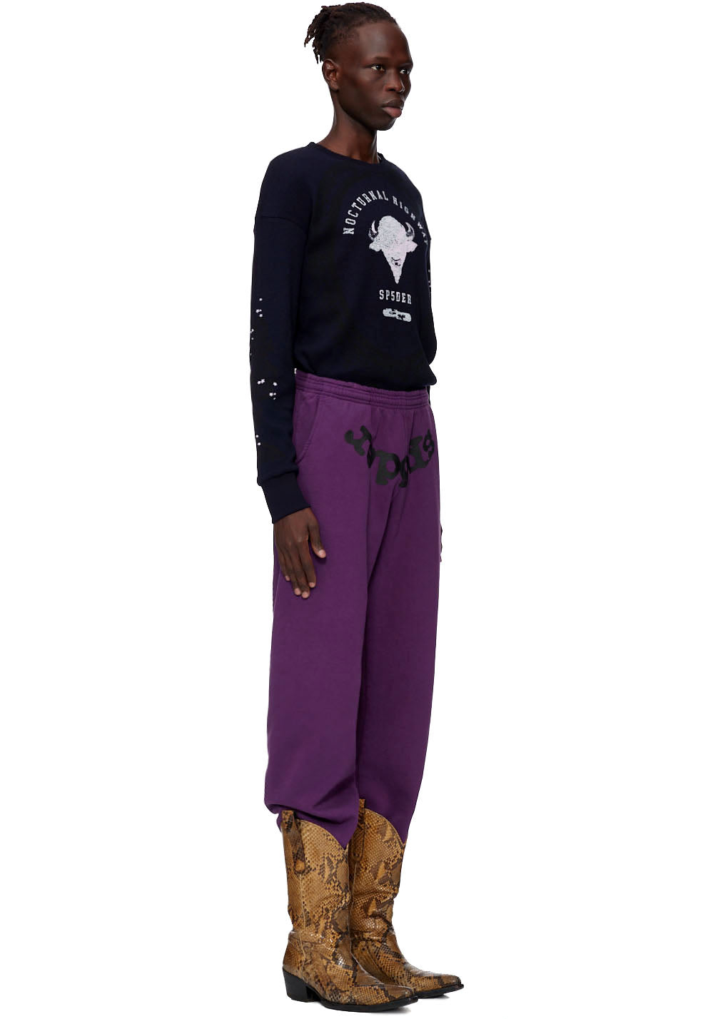 Purple SP5DER CLASSIC SWEATPANT with black puff print logo, paired with a black long-sleeve shirt.