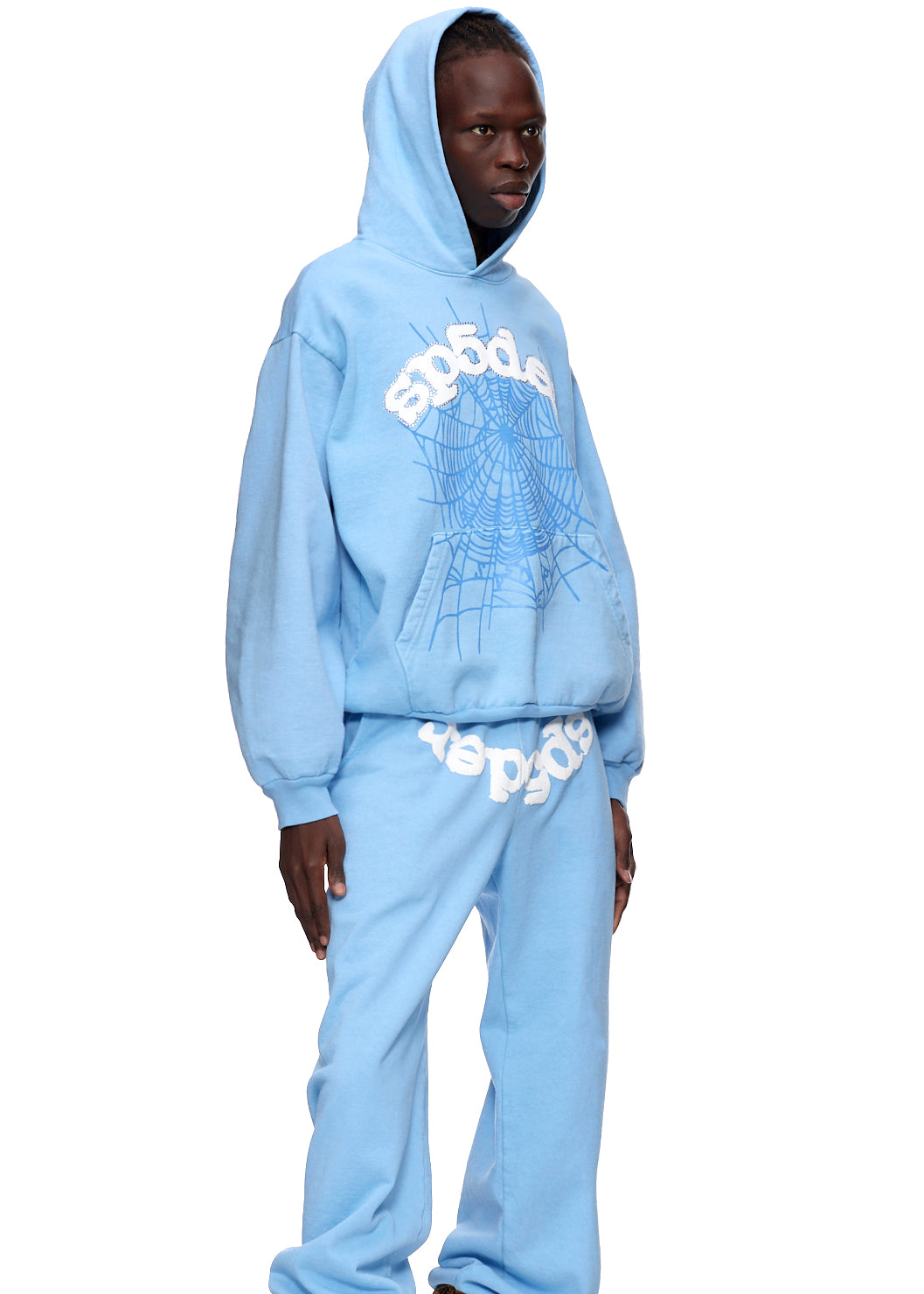 Light blue WEB HOODIE and sweatpants with white puff print "SP5DER" and blue web graphic.