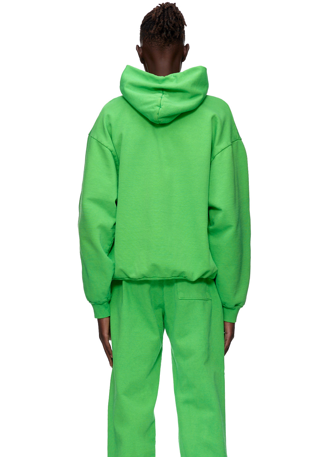Back view of a person wearing a bright green WEB HOODIE and matching sweatpants.