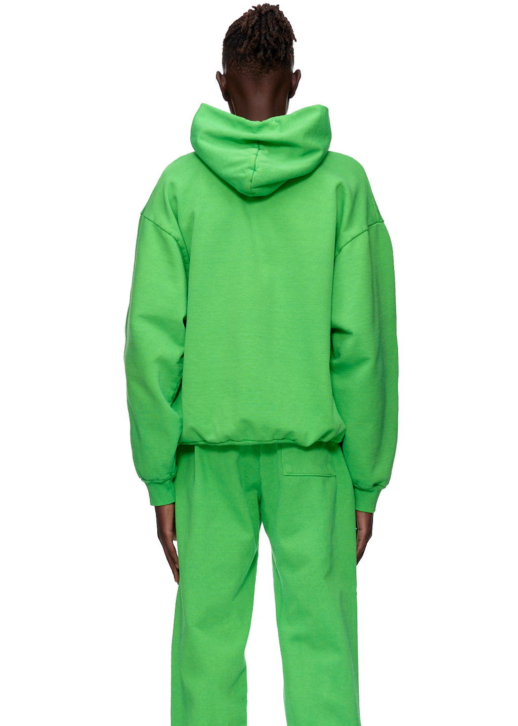 Back view of a person wearing a bright green WEB HOODIE and matching sweatpants.