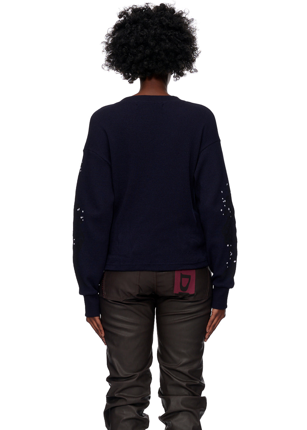 Back view of a person wearing a custom-dyed navy 10oz waffle thermal with tonal and contrasted graphic print on sleeves.
