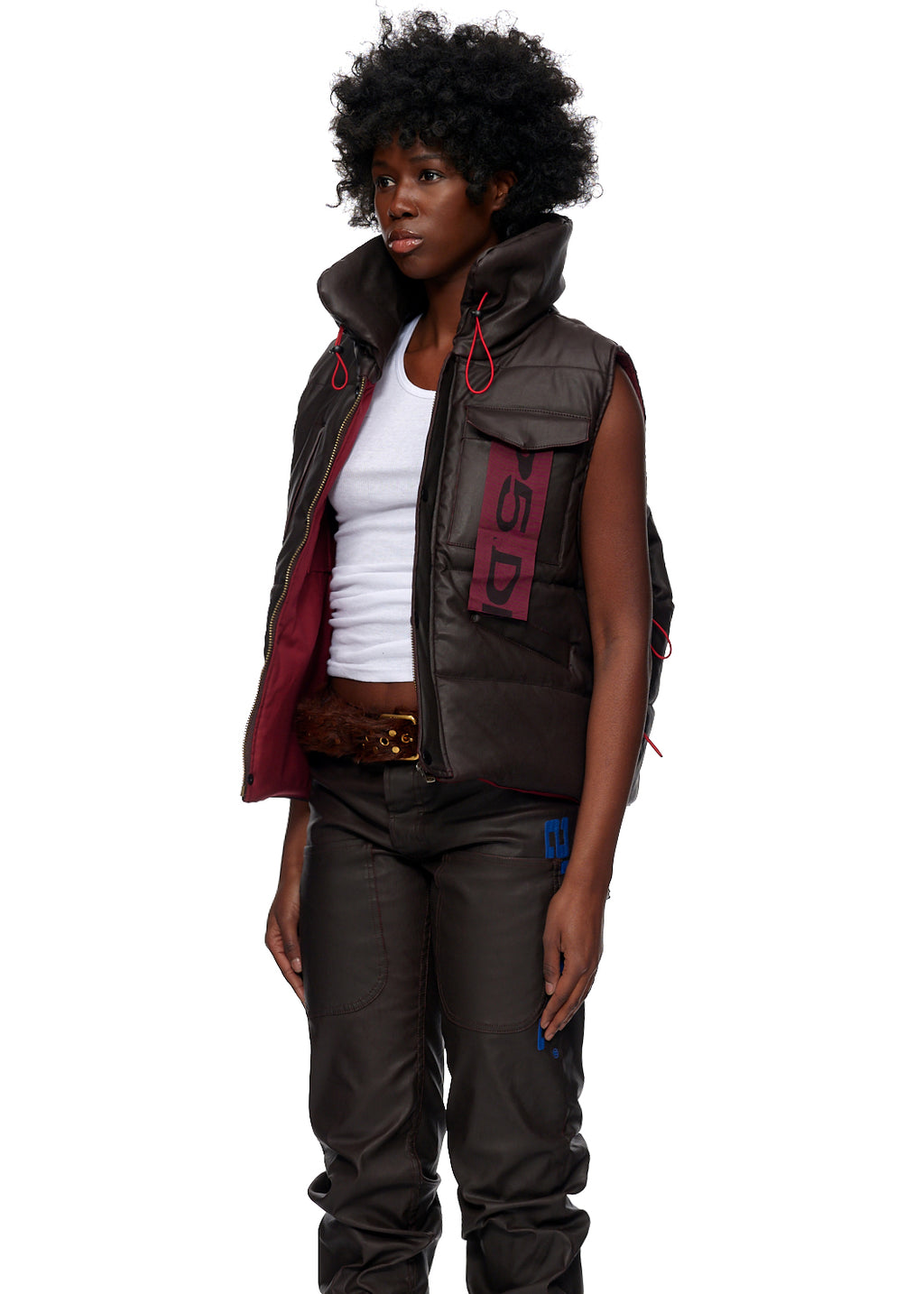 Brown coated canvas hooded puffer vest with red accents and SP5DER branding.
