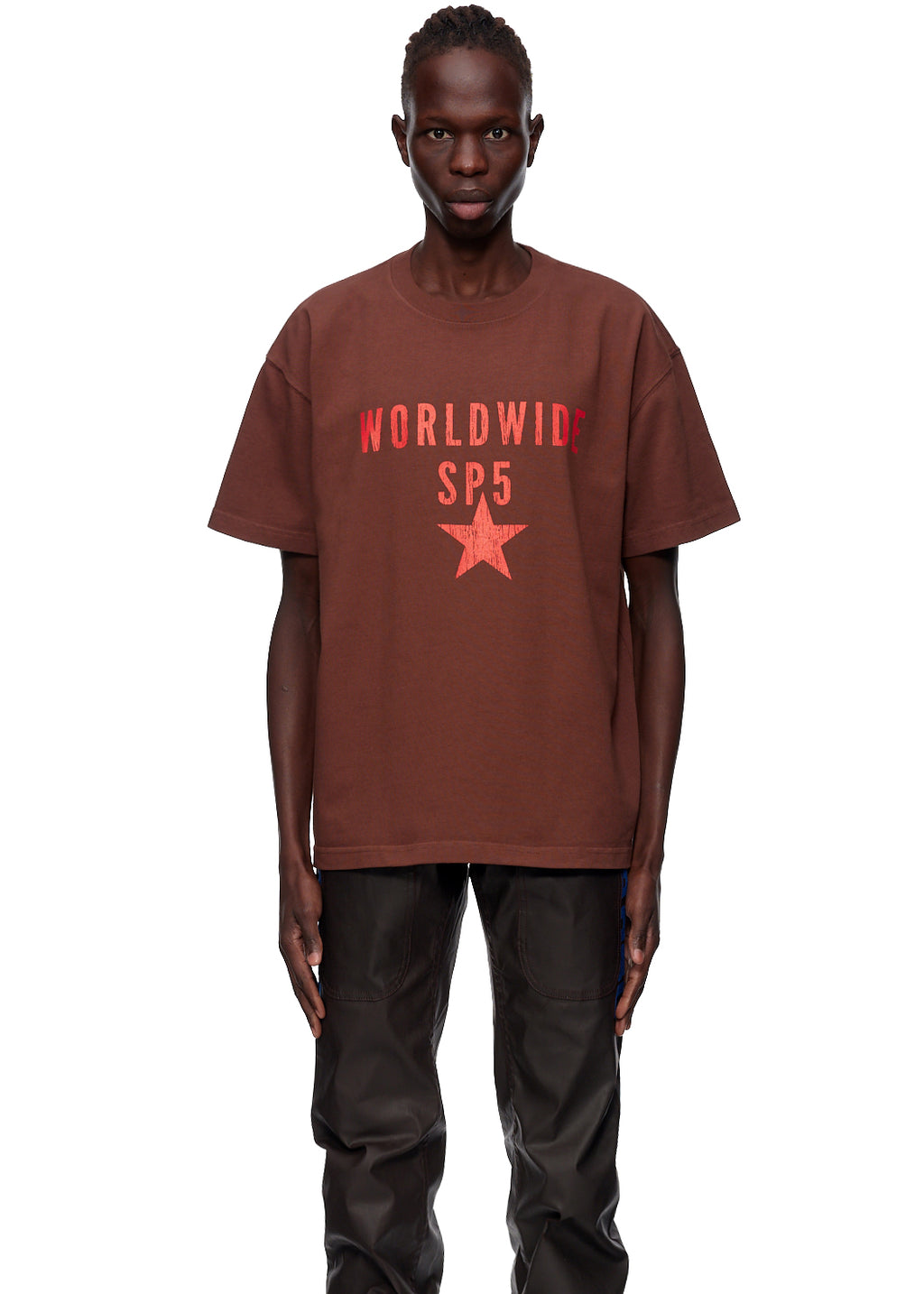 Brown oversized cotton jersey tee with "WORLDWIDE SP5" and red star graphic.