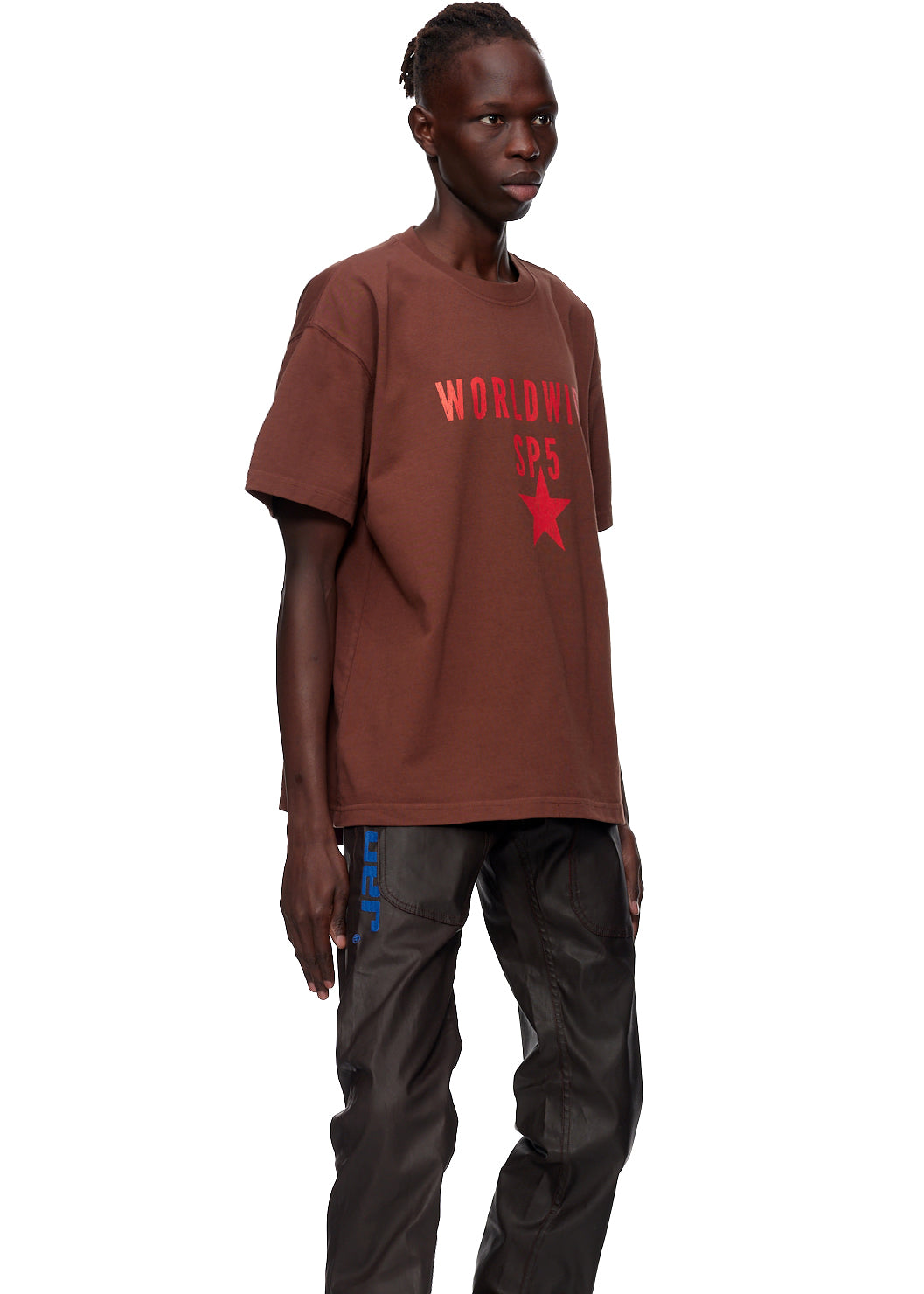 Oversized brown cotton jersey tee with "WORLDWIDE SP5" text and red star graphic.