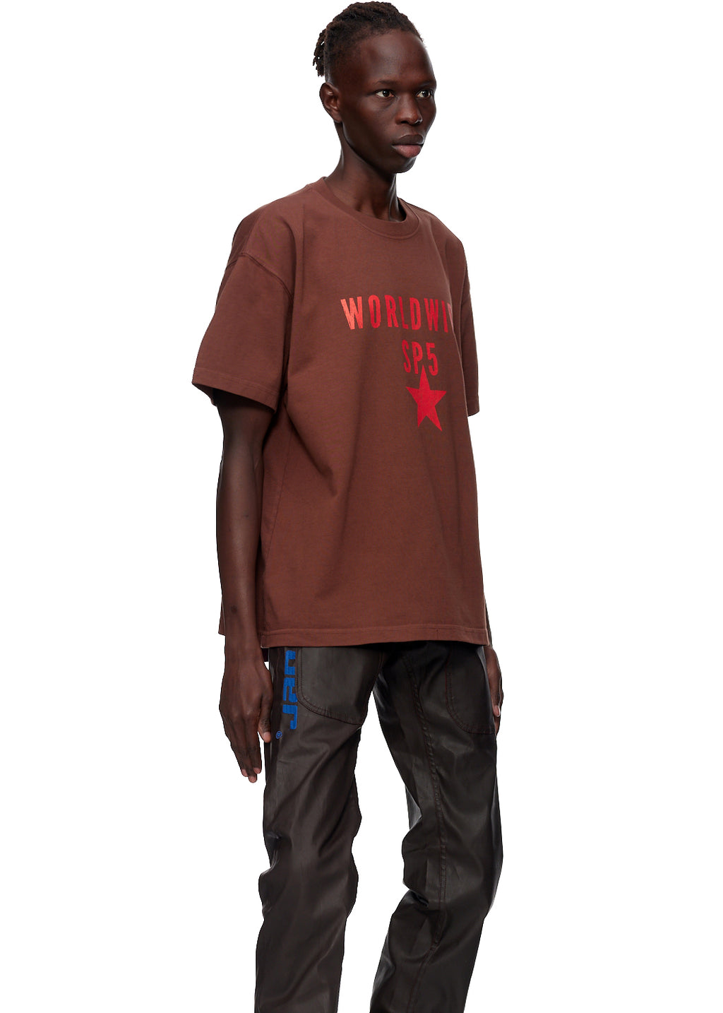 Oversized brown cotton jersey tee with "WORLDWIDE SP5" text and red star graphic.
