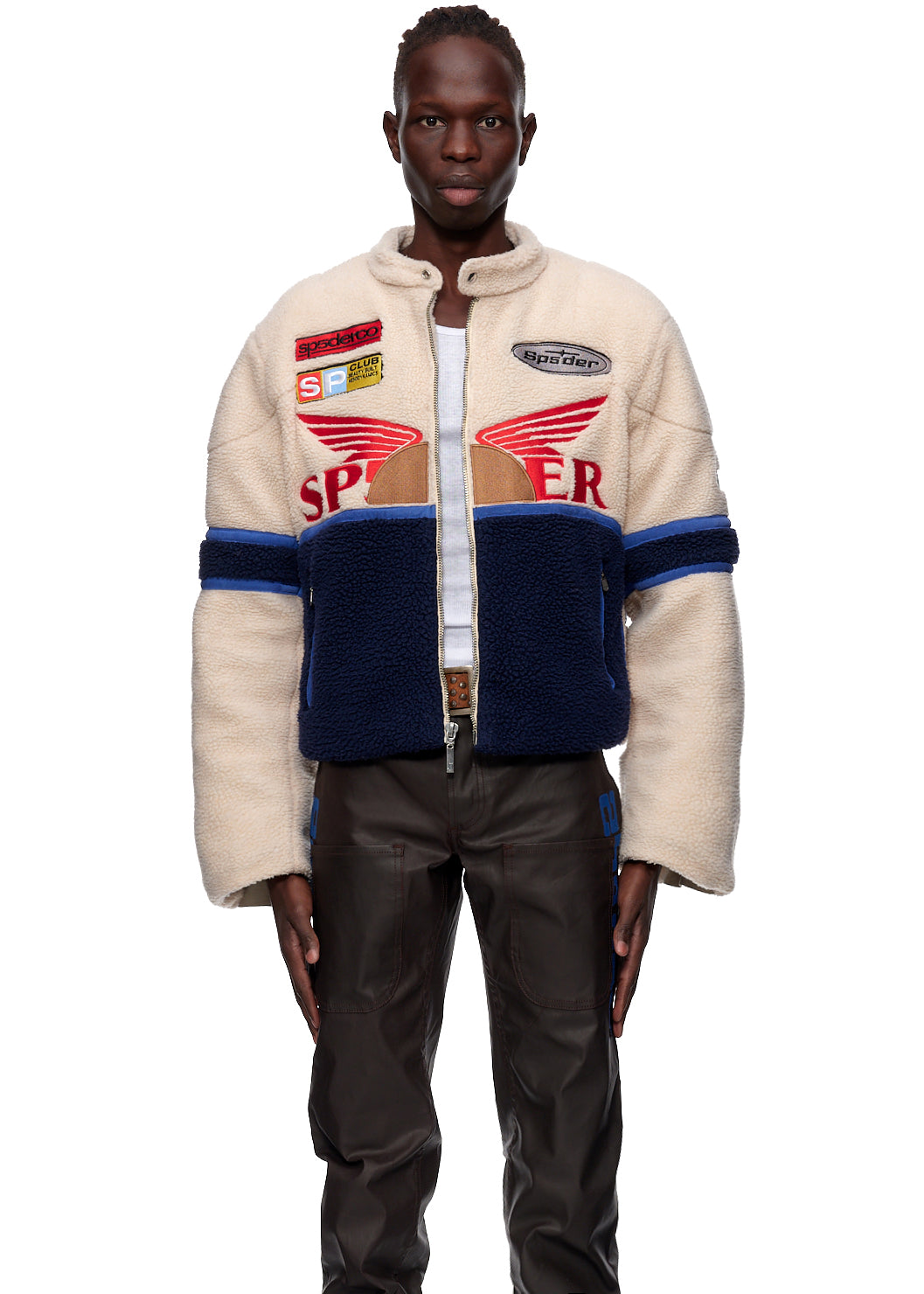 Sherpa Cafe Racer jacket, cream and navy with red SP5DER patches, leather trim, and racing details.