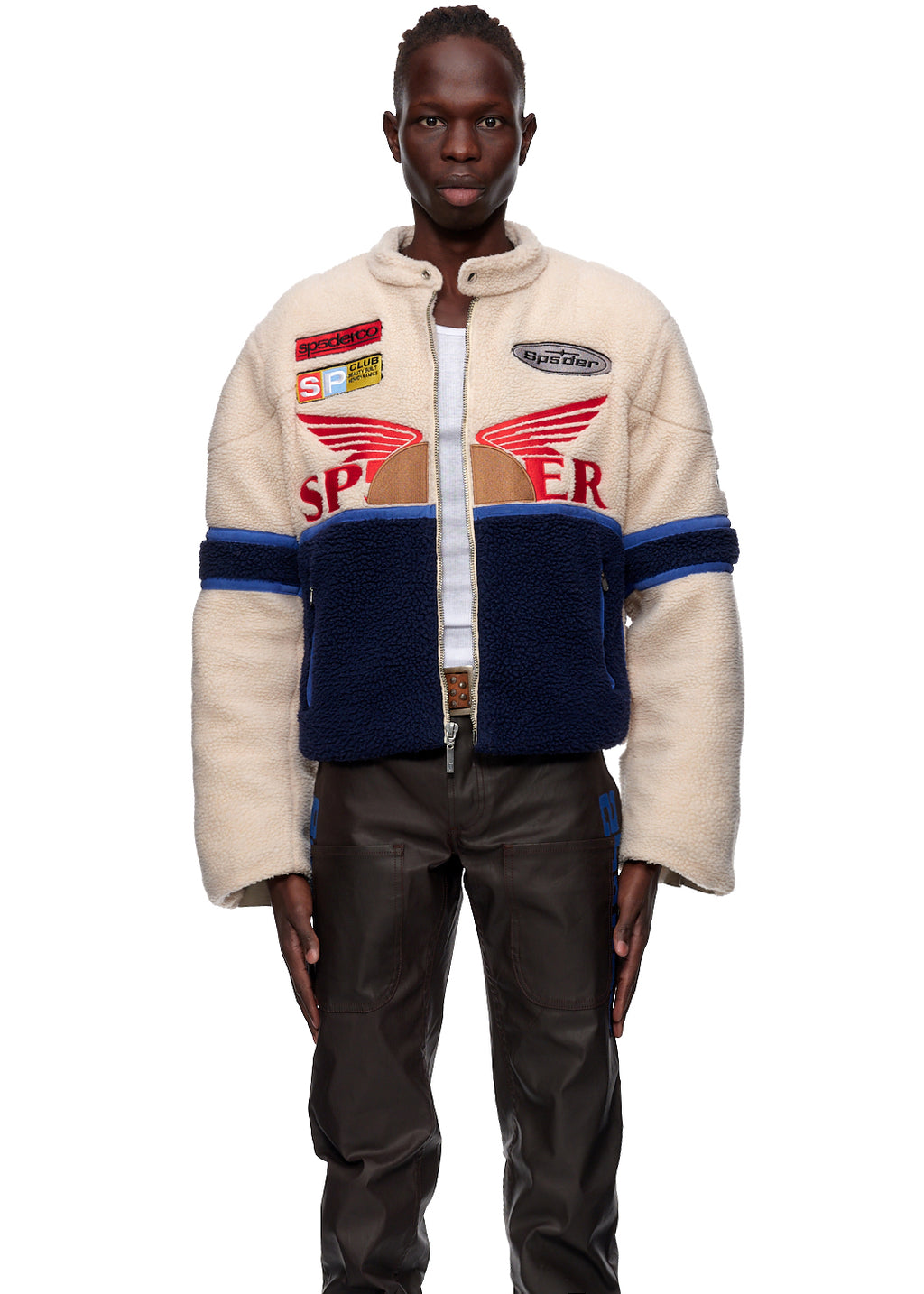 Sherpa Cafe Racer jacket, cream and navy with red SP5DER patches, leather trim, and racing details.