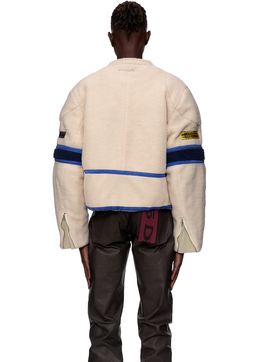 Sherpa Cafe Racer jacket, cream polyester with blue stripes, leather trim, and SP5DER patches.
