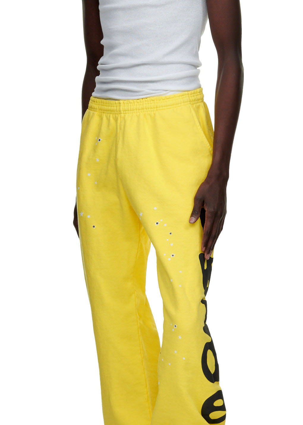 Yellow BELUGA SWEATPANT with "Worldwide" puff/discharge print, white stars, and elastic waist.
