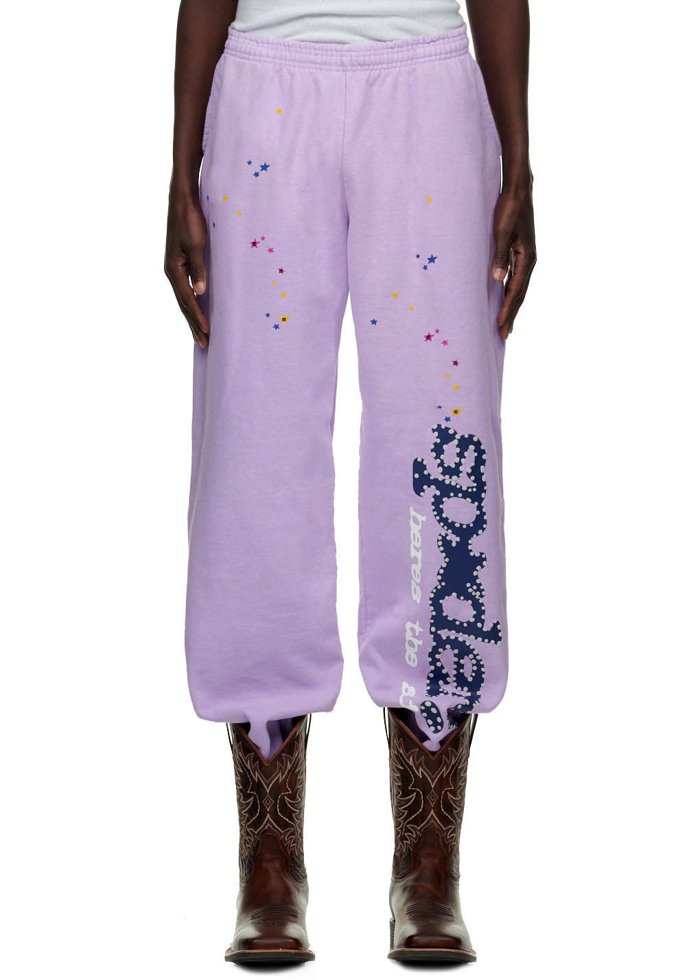 Açaí SP5DER sweatpants, light purple 23oz fleece with puff print SP5DER motif and colorful star prints.