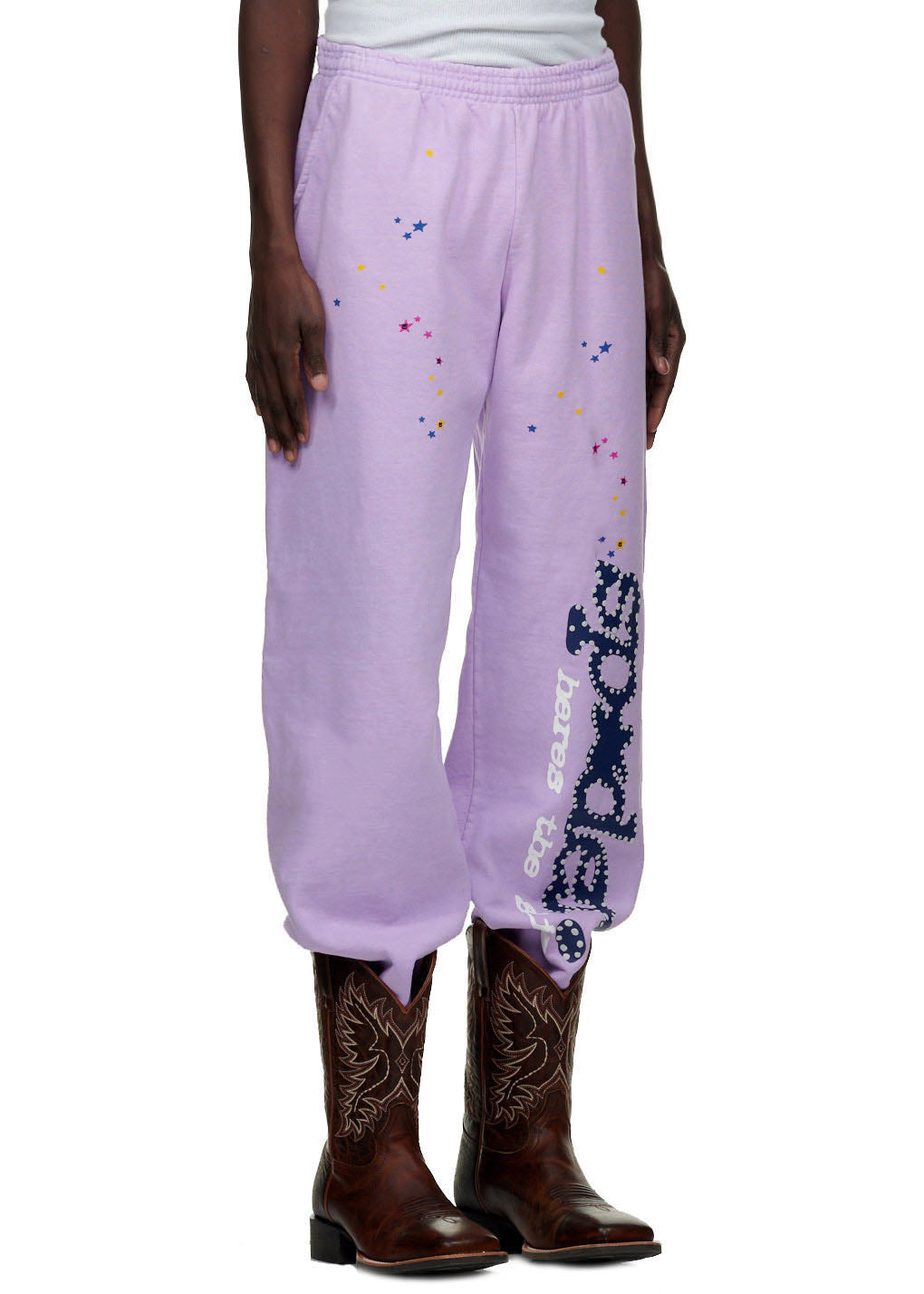 AÇAÍ SP5DER SWEATPANT: Lavender fleece sweatpants with colorful stars and "SP5DER" motif.