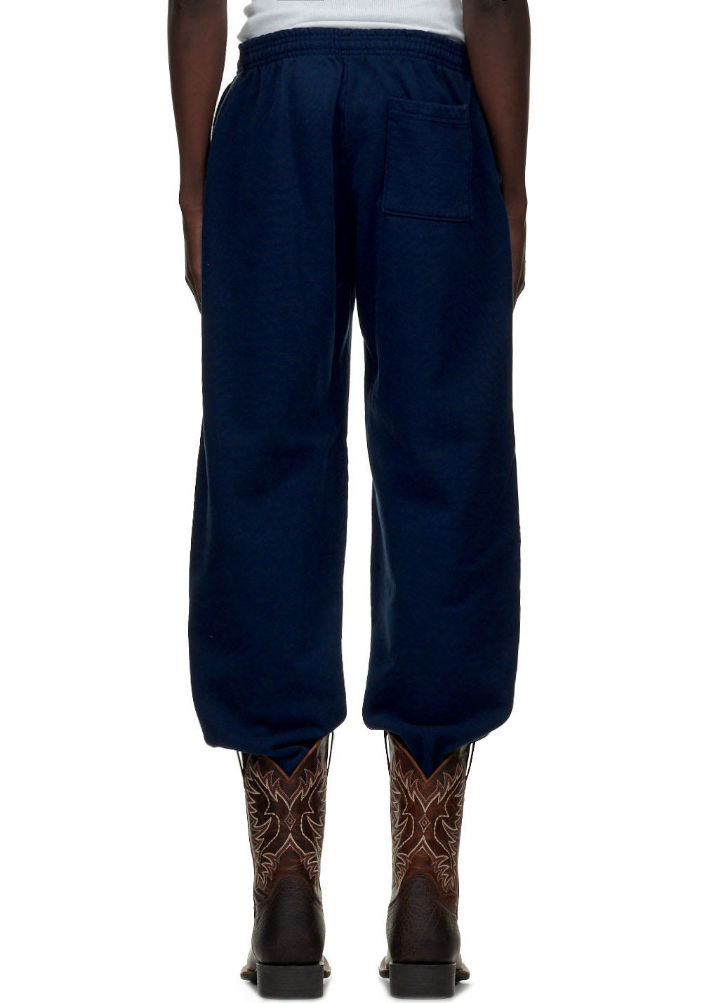 Navy blue ATLANTA SWEATPANT, 23oz fleece, with a back pocket, worn with cowboy boots.