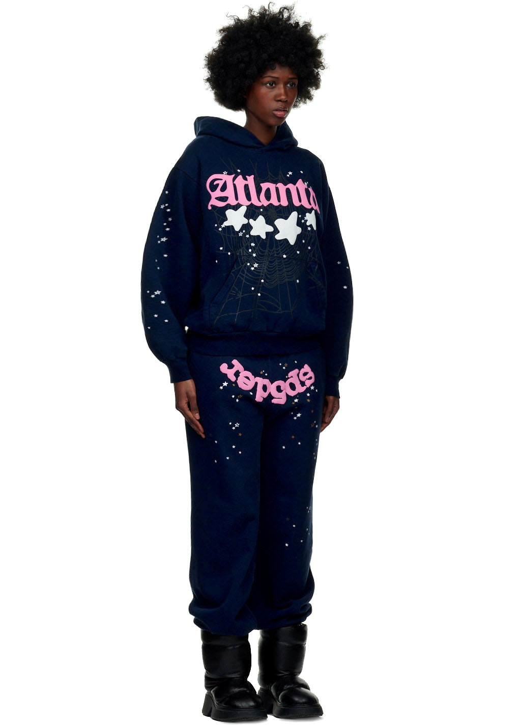 Female model in a navy 23oz fleece Atlanta hoodie and matching sweatpants with pink puff print and star designs.