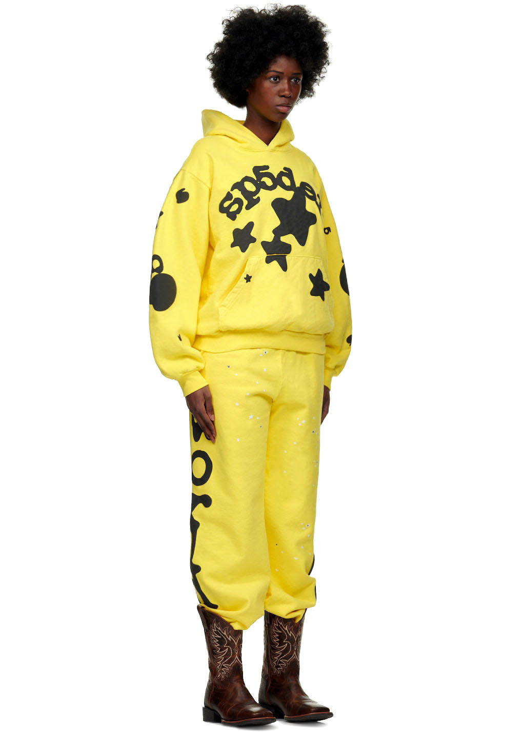 Female model in yellow BELUGA SWEATPANT with puff/discharge print, "Worldwide" down legs, and matching hoodie.
