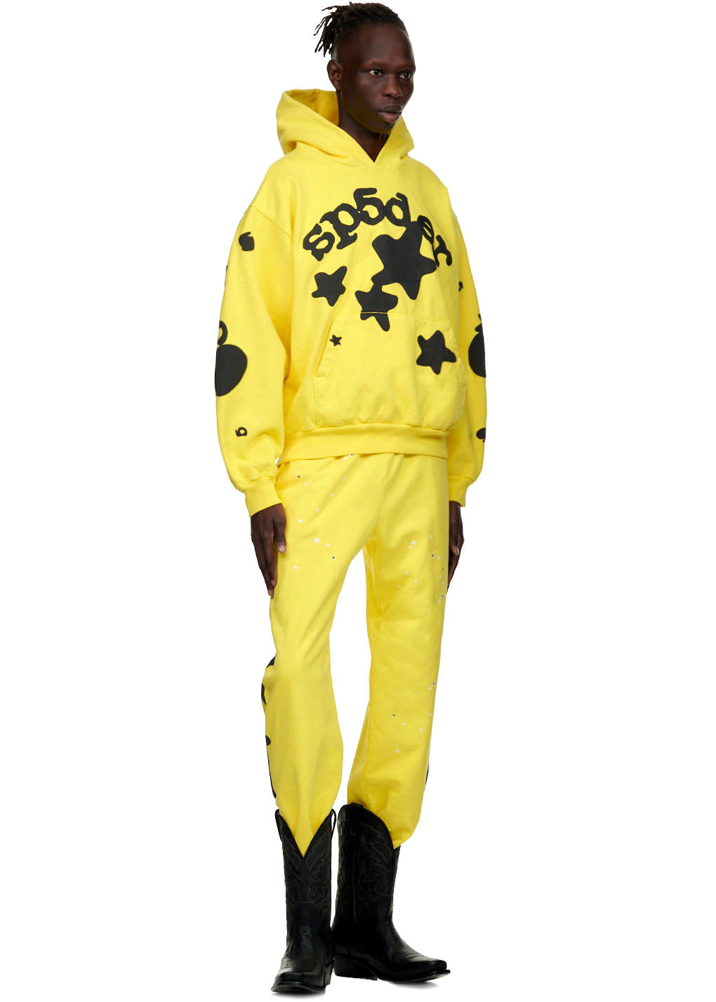 Yellow BELUGA HOODIE and sweatpants with black 'SP5DER' and star print, worn by a male model.