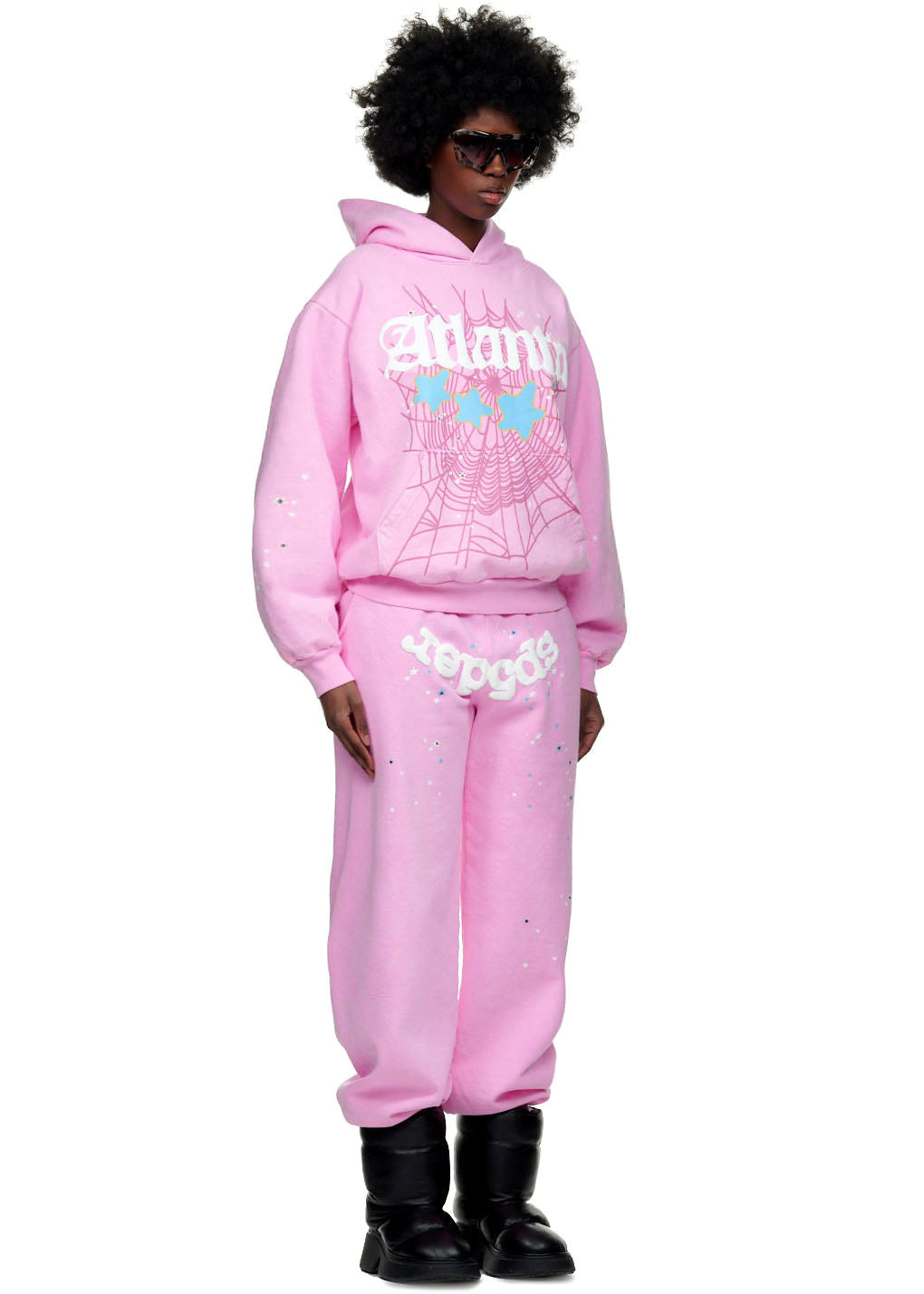 Pink ATLANTA SWEATPANT and matching hoodie with Sp5der and star print, worn by a female model.