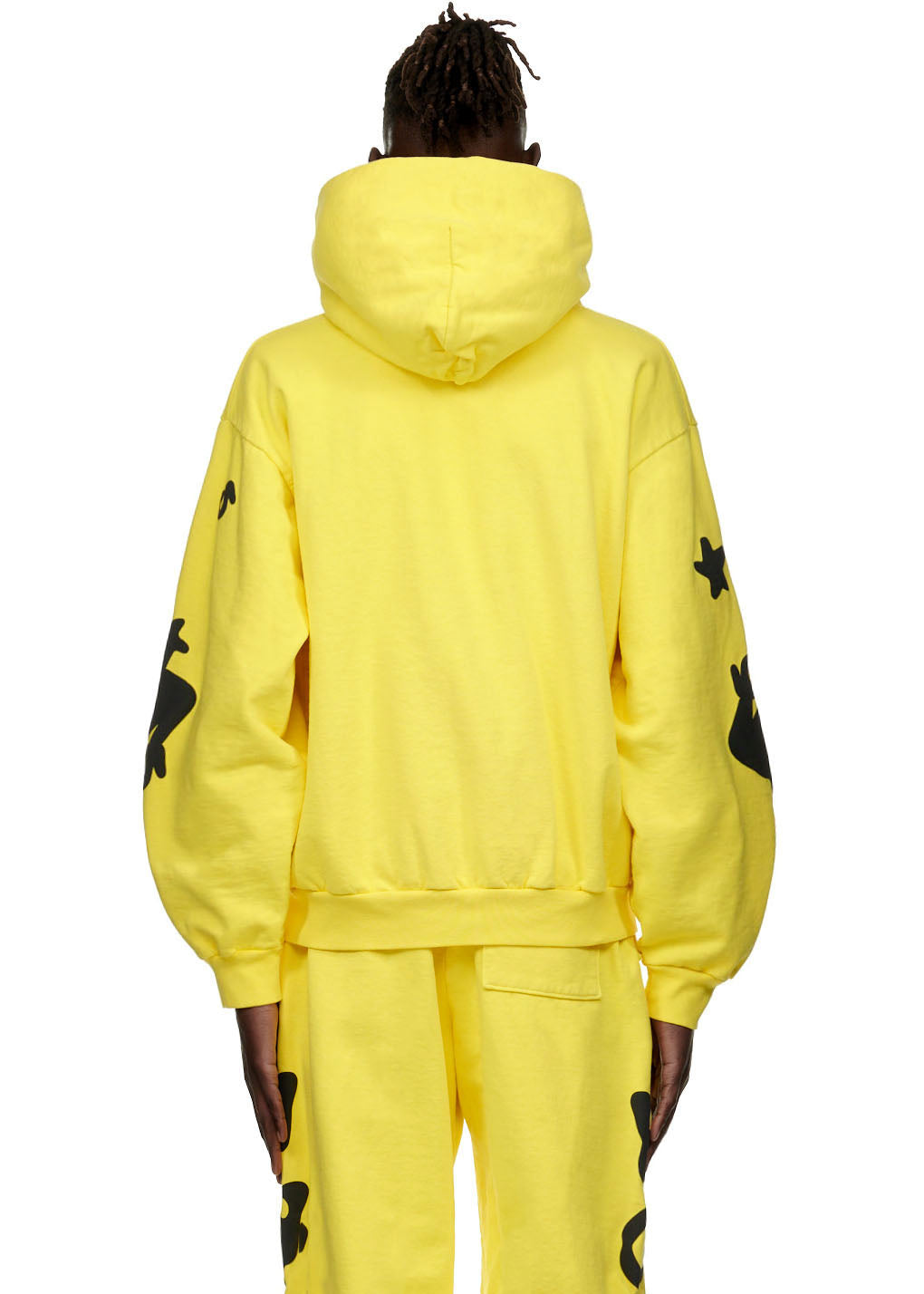 BELUGA HOODIE: Yellow 23oz fleece hoodie with black puff print designs on sleeves, worn by a male model.
