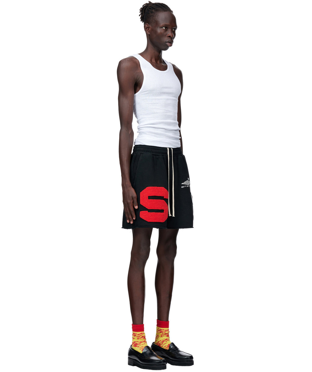 Black French terry CUT SWEATSHORT with large red chenille "S" patch, SP5DER embroidery, and raw hem.