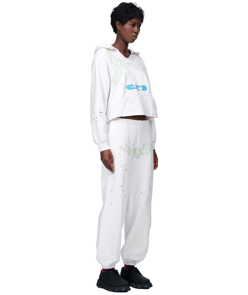 White cropped hoodie and sweatpants set with puff print, discharge print, and custom racing patch.