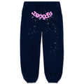 Navy blue fleece sweatpants with pink puff print "Sp5der" and scattered star graphics.