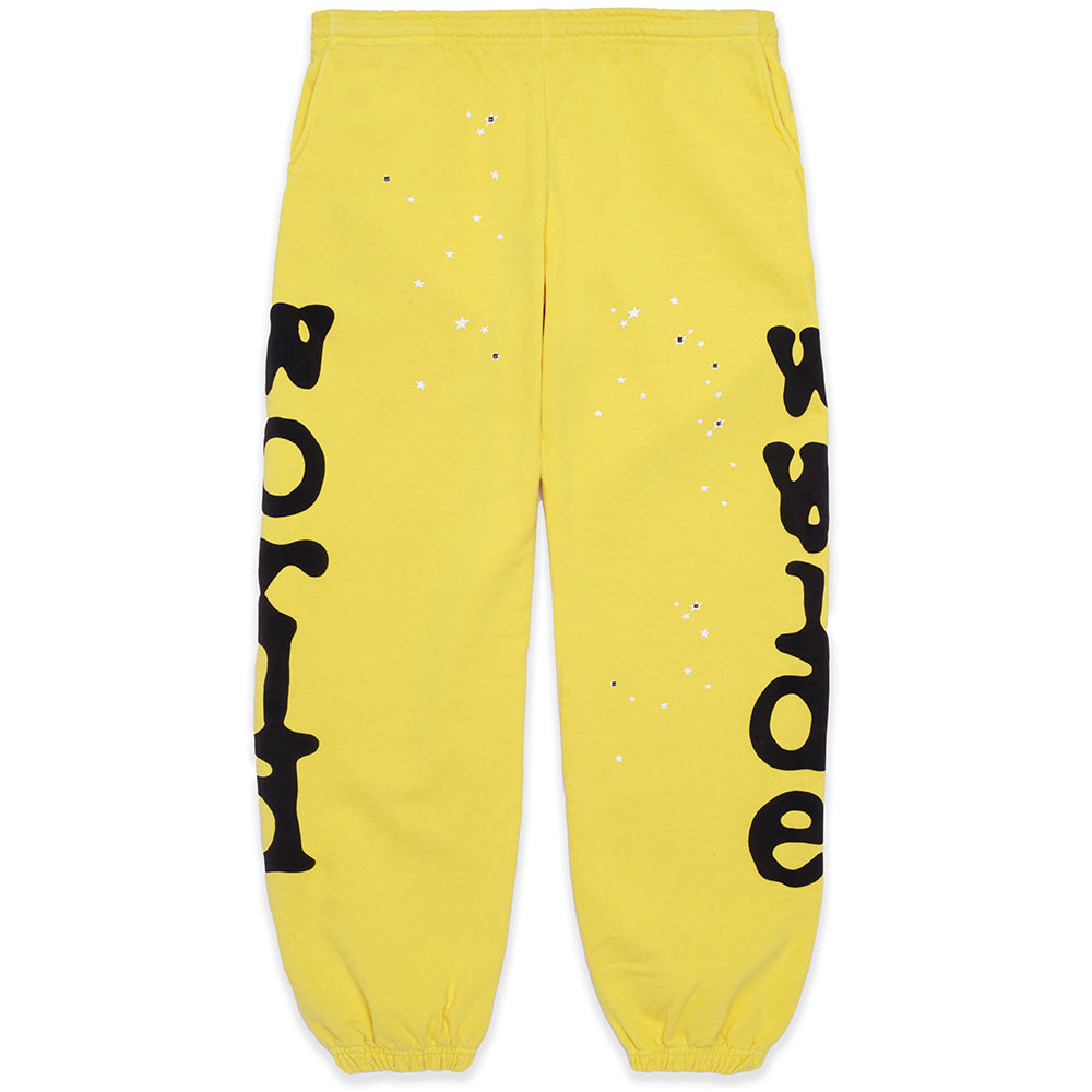 Yellow Beluga sweatpants with "Worldwide" puff print down legs and small white stars.