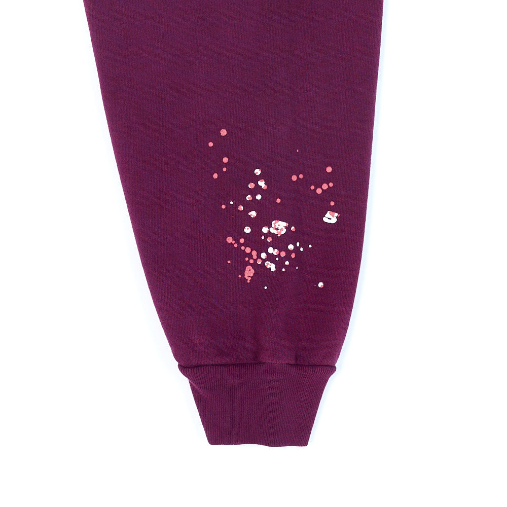 Maroon 23oz fleece hoodie cuff with pink and white puff/discharge print splatter design.